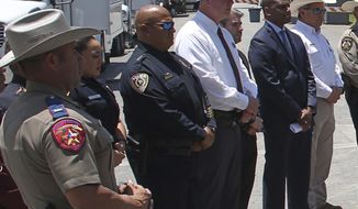 FILE - Uvalde School Police Chief Pete Arredondo, third from left, stands during a news conference outside of the Robb Elementary school in Uvalde, Texas, on May 26, 2022. As public pressure mounts for more information on the deadly Uvalde school shooting, some are concerned that Texas officials will use a legal loophole to block records from being released — even to the victims&#39; families — once the case is closed.(AP Photo/Dario Lopez-Mills, File)