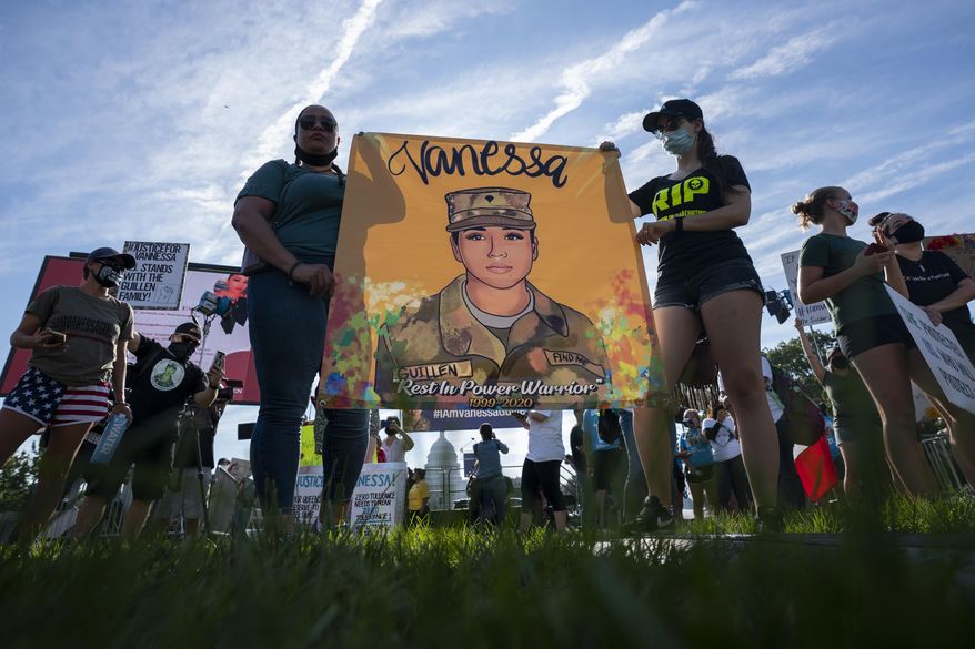 Supporters of the family of slain Army Spc. Vanessa Guillen gather before a news conference on the National Mall in front of Capitol Hill, on July 30, 2020, in Washington. As public pressure mounts for more information on the deadly Uvalde school shooting, some are concerned that Texas officials will use a legal loophole to block records from being released — even to the victims&#x27; families — once the case is closed. (AP Photo/Carolyn Kaster, File)