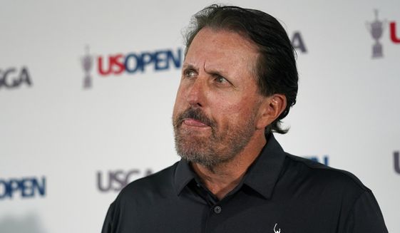 Phil Mickelson ponders a question at a press conference, Monday, June 13, 2022, at The Country Club in Brookline, Mass., ahead of the U.S. Open golf tournament. (AP Photo/Robert F. Bukaty)