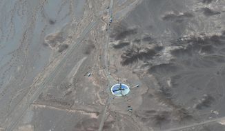 This satellite image from Maxar Technologies shows an overview of launch pad activity at Imam Khomeini Space Center southeast of Semnan, Iran on Tuesday, June 14, 2022.   Iran appeared to be readying for a space launch Tuesday as satellite images showed a rocket on a rural desert launch pad, just as tensions remain high over Tehran&#39;s nuclear program.  The images from Maxar Technologies showed a launch pad at Imam Khomeini Spaceport in Iran’s rural Semnan province, the site of frequent recent failed attempts to put a satellite into orbit.   (Satellite image ©2022 Maxar Technologies via AP)