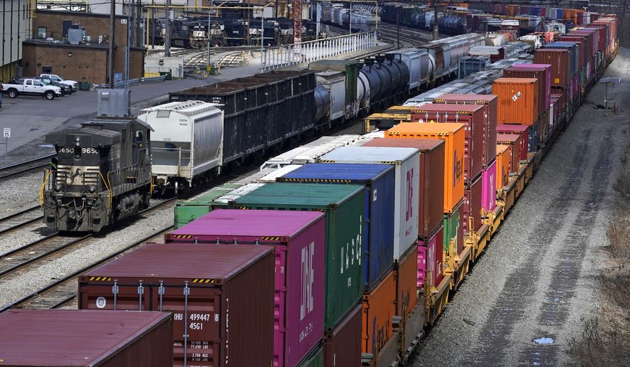 This April 2, 2021, file photo shows freight train cars and containers at Norfolk Southern Railroad&#39;s Conway Yard in Conway, Pa. On Tuesday, June 14, 2022, the National Mediation Board decided that mediation isn&#39;t working in the joint talks that cover roughly 140,000 workers in 13 unions at the biggest freight railroads that deliver the raw materials many companies rely upon and the cars, chemicals and containers full of consumer goods they make. (AP Photo/Gene J. Puskar, File)