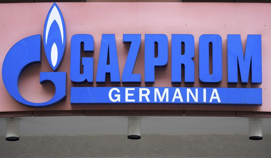 The logo of &#39;Gazprom Germania&#39; is pictured at the company&#39;s headquarters in Berlin, April 6, 2022. Russian state-controlled energy giant Gazprom says gas deliveries through a key pipeline to Europe will drop by around 40% this year. The dpa news agency reports Tuesday, June 14 that Germany’s utility network agency said it didn&#39;t see gas supplies as endangered and that reduced amounts through the Nord Stream 1 pipeline under the Baltic Sea aligned with commercial behavior and the previously announced cutoff of gas to Denmark and the Netherlands. (AP Photo/Michael Sohn, File)
