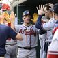 Atlanta Braves&#39; William Contreras, center, celebrates in the dugout after he scored on a single by Michael Harris II during the fourth inning of a baseball game against the Washington Nationals, Wednesday, June 15, 2022, in Washington. (AP Photo/Nick Wass)