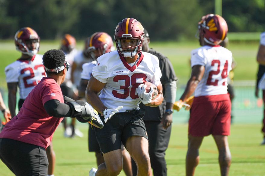Washington Commanders running back Reggie Bonofon (38) doing drills with Assistant Running Backs Coach Jennifer King during veteran minicamp at the team's Inova Sports and Performance Center in Ashburn, VA, June 15, 2022. (Photo by All-Pro Reels)
