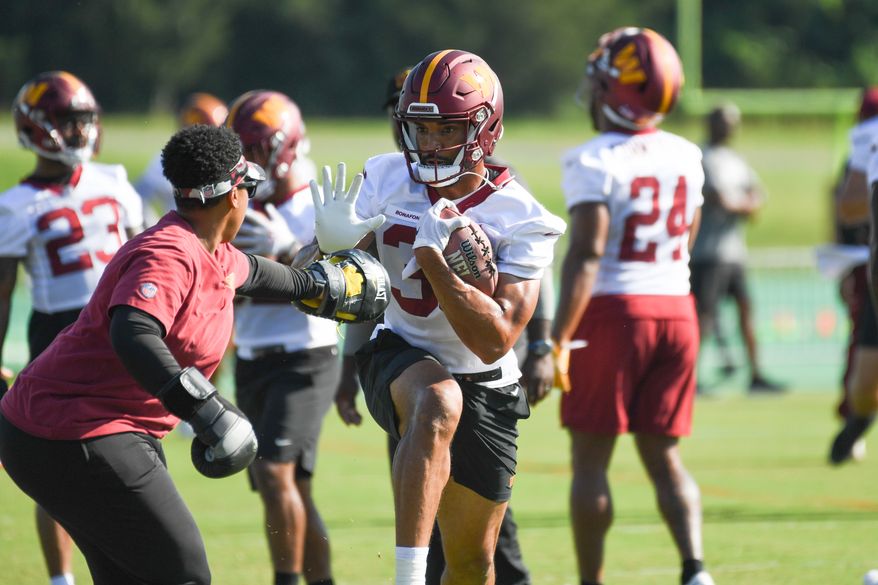 Washington Commanders running back Reggie Bonofon (38) doing drills with Assistant Running Backs Coach Jennifer King during veteran minicamp at the team's Inova Sports and Performance Center in Ashburn, VA, June 15, 2022. (Photo by All-Pro Reels)