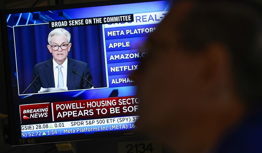 Federal Reserve Chairman Jerome Powell's news conference is displayed on televisions while traders work on the floor at the New York Stock Exchange in New York, Wednesday, June 15, 2022. The Federal Reserve intensified its drive to tame high inflation by raising its key interest rate by three-quarters of a point — its largest hike in nearly three decades — and signaling more large rate increases to come that would raise the risk of another recession. (AP Photo/Seth Wenig)