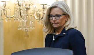 Vice Chair Rep. Liz Cheney, R-Wyo., arrives on the dais as the House select committee investigating the Jan. 6, 2021, attack on the Capitol holds a hearing at the Capitol in Washington, Thursday, June 16, 2022. (AP Photo/Susan Walsh)