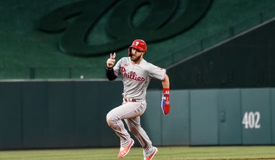 Philadelphia Phillies designated hitter Bryce Harper (3) running to third base after a double by right fielder Nick Castellanos (8) during the 4th inning in a game against the Washington Nationals