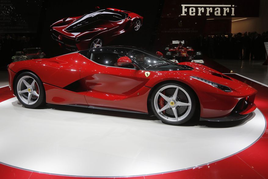 The new Ferrari, named LaFerrari, is presented during the first media day of the 83rd Geneva International Motor Show, Switzerland, March 5, 2013. Italian luxury sports car maker Ferrari on Thursday, June 16, 2022 outlined its electrification strategy that calls for 40% full-electric and 40% hybrid models by 2030. (AP Photo/Laurent Cipriani, File)