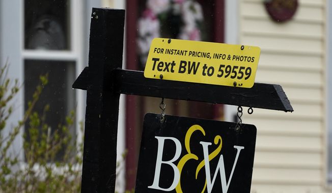 A sign is displayed outside a home in Wheeling, Ill., Thursday, May 5, 2022.  Average long-term U.S. mortgage rates made their biggest one-week jump in 35 years, one day after the Federal Reserve raised its key rate by three-quarters of a point in bid to tame high inflation. Mortgage buyer Freddie Mac reported Thursday, June 16,  that the 30-year rate climbed from 5.23% last week to 5.78% this week, the highest its been since November of 2008 during the housing crisis.   (AP Photo/Nam Y. Huh)