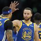 Golden State Warriors guard Stephen Curry (30) high fives Golden State Warriors guard Gary Payton II (0) during the second quarter of Game 6 of basketball&#39;s NBA Finals against the Boston Celtics, Thursday, June 16, 2022, in Boston. (AP Photo/Steven Senne)