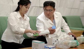 In this photo provided by the North Korean government, North Korean leader Kim Jong Un and his wife Ri Sol Ju prepare medicines at an unannounced place in North Korea Wednesday, June 15, 2022 to send them to Haeju City where an infectious disease occurred. Independent journalists were not given access to cover the event depicted in this image distributed by the North Korean government. The content of this image is as provided and cannot be independently verified. Korean language watermark on image as provided by source reads: &amp;quot;KCNA&amp;quot; which is the abbreviation for Korean Central News Agency. (Korean Central News Agency/Korea News Service via AP)