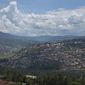 The Rwandan capital of Kigali is seen from one of the overlooking hills on April 6, 2014. Expectations are high in Rwanda as the East African nation prepares to host the Commonwealth Heads of Government Summit in June 2022. (AP Photo/Ben Curtis, File)