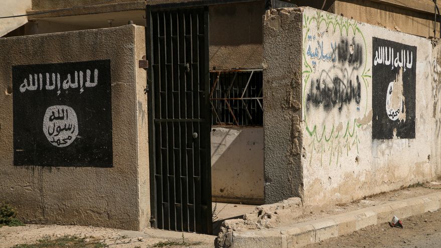U.S. troops launched a counterterrorism operation on Thursday that resulted in the capture of an experienced Islamic State bomb maker who also was identified as a top leader of the ISIS branch in Syria. Photo: Aleppo, Syria 18 NOV 2017. Logos written by ISIS fighters on the walls. Mohammad Bash via Shutterstock. *FILE*