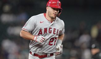 Los Angeles Angels&#39; Mike Trout runs the bases after he hit a two-run home run against the Seattle Mariners during the seventh inning of a baseball game Thursday, June 16, 2022, in Seattle. The homer was Trout&#39;s second of the night. (AP Photo/Ted S. Warren)