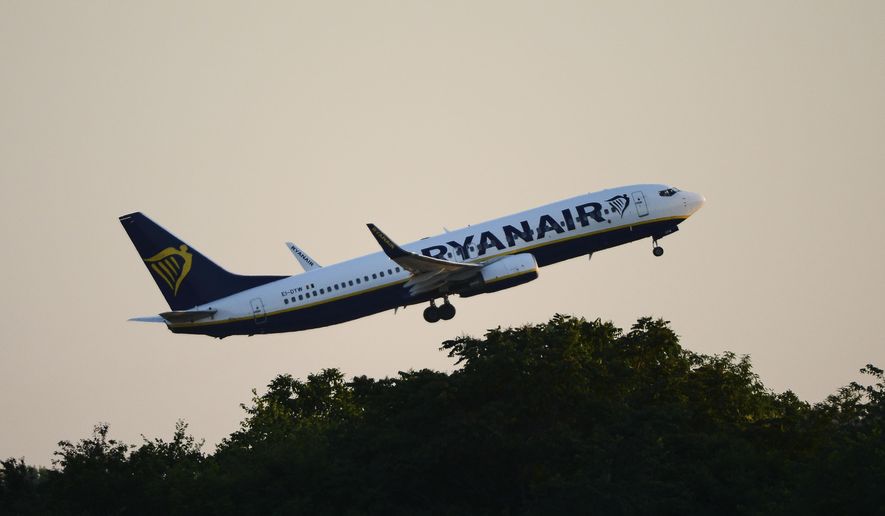 A Ryanair plane takes off from Budapest Airport, in Budapest, Hungary, Sunday, June 12, 2022. Hungary has placed price caps on fuel and some food and imposed special taxes on industries as the government tries to ease an economic downturn and the highest inflation in nearly 25 years. (AP Photo/Anna Szilagyi)