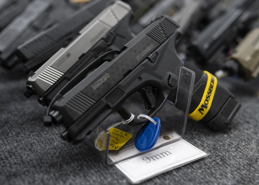 Pistols sit on display during the first day of the Silver Spur Gun and Blade Show Saturday, Jan. 22, 2022, in Odessa, Texas. On Friday, June 17, 2022. (Eli Hartman/Odessa American via AP)