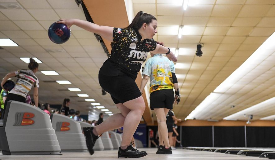 Maria Bulanova, a member of the Professional Women&#39;s Bowling Association and an assistant coach at St. Francis College, practices at Kingpin&#39;s Alley and Family Center, Wednesday, June 15, 2022, in Glens Falls, N.Y. Title IX has opened the door for thousands of female athletes from abroad to get an American education and a shot at a life and career in the United States. (AP Photo/Hans Pennink)