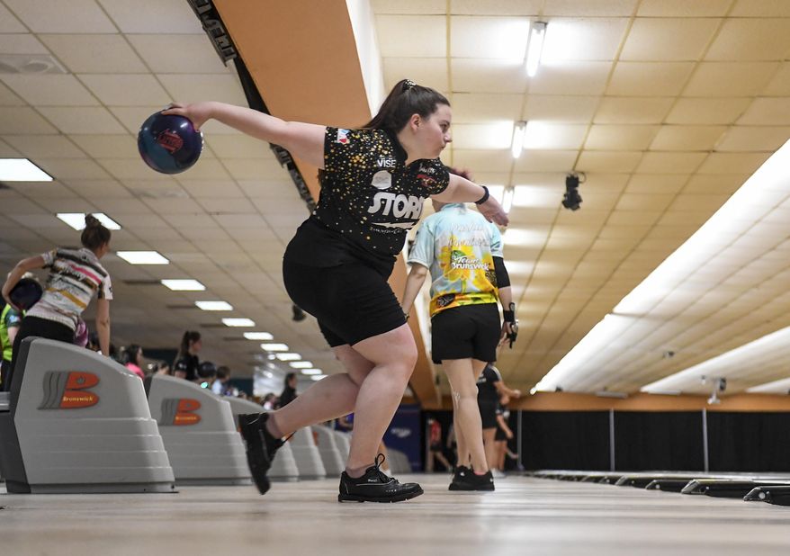 Maria Bulanova, a member of the Professional Women&#39;s Bowling Association and an assistant coach at St. Francis College, practices at Kingpin&#39;s Alley and Family Center, Wednesday, June 15, 2022, in Glens Falls, N.Y. Title IX has opened the door for thousands of female athletes from abroad to get an American education and a shot at a life and career in the United States. (AP Photo/Hans Pennink)