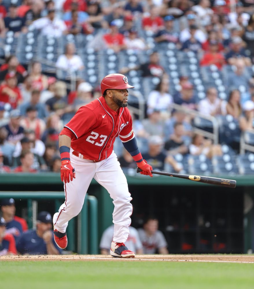 Designated Hitter Nelson Cruz (#23) makes contact with the pitch,just about to drop the bat and run to first at Washington Nationals vs Atlanta Braves at Nationals Park in Washington DC on June 15th 2022 (Photo: All-Pro Reels/Alyssa Howell)