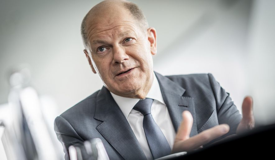 German Chancellor Olaf Scholz speaks during an interview in his office at the Chancellery, in Berlin, Germany, Friday June 17, 2022. (Michael Kappeler/dpa via AP)