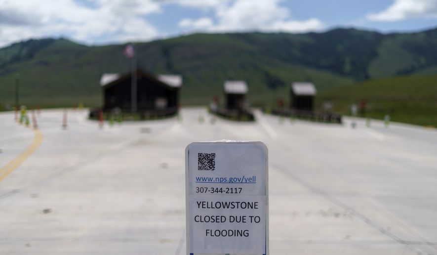 The entrance to Yellowstone National Park, a major tourist attraction, sits closed due to the historic floodwaters on June 15, 2022, in Gardiner, Mont. Created in 1872 as the United States was recovering from the Civil War, Yellowstone was the first of the national parks that have been referred to as America&#39;s best idea. Now, the home to soaring geysers and some of the country&#39;s most plentiful and diverse wildlife is facing its biggest challenge in decades. (AP Photo/David Goldman, File)  **FILE**
