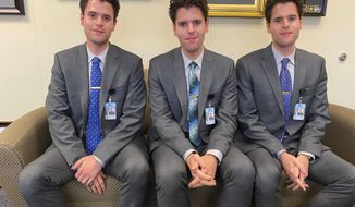 Nicholas, Zachary and Benjamin Osborne are three identical triplets who grew up in Rocky Mount and spent a life doing everything together, now including interning for N.C. Senator Jim Burgin. (Josh Shaffer/The News &amp;amp; Observer via AP)