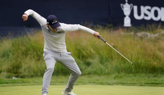 Matthew Fitzpatrick, of England, reacts after a putt on the 13th hole during the final round of the U.S. Open golf tournament at The Country Club, Sunday, June 19, 2022, in Brookline, Massachusetts. (AP Photo/Julio Cortez)