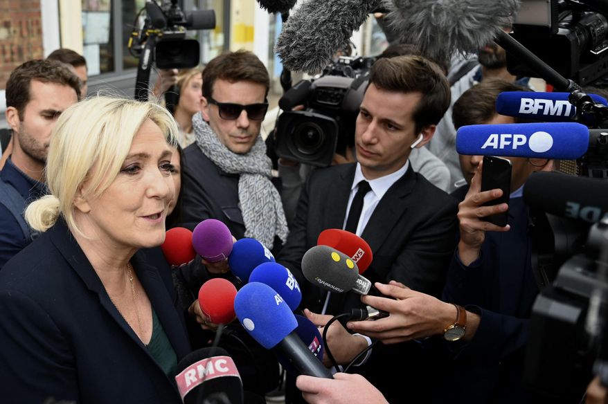 French far-right leader Marine Le Pen adresses reporters Monday, June 20, 2022 in Henin-Beaumont, northern France. French President Emmanuel Macron&#x27;s centrist alliance was projected to lose its majority despite getting the most seats in the final round of parliamentary elections Sunday, while the far-right National Rally appeared to have made big gains. (AP Photo)