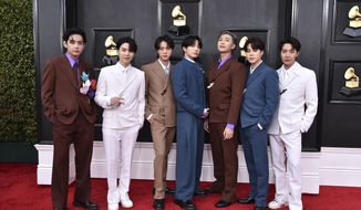 BTS arrives at the 64th Annual Grammy Awards at the MGM Grand Garden Arena on Sunday, April 3, 2022, in Las Vegas. The surprise announcement by BTS that they were taking a break to focus on members’ solo projects stunned their global fanbase, shaking their label&#x27;s stock price and leaving many questions about the K-pop supergroup’s future. (Photo by Jordan Strauss/Invision/AP, File)