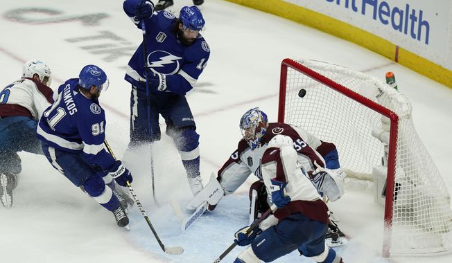 Tampa Bay Lightning left wing Pat Maroon (14) scores past Colorado Avalanche goaltender Darcy Kuemper (35) during the second period of Game 3 of the NHL hockey Stanley Cup Final on Monday, June 20, 2022, in Tampa, Fla. (AP Photo/Chris O&#x27;Meara)