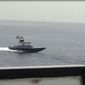 In this image from a video made available by the U.S. Navy, a boat of Iran&#39;s Islamic Revolutionary Guard Corps Navy (IRGCN) operates in close proximity to patrol coastal ship USS Sirocco (PC 6) and expeditionary fast transport USNS Choctaw County (T-EPF 2) in the Strait of Hormuz, Monday, June 20, 2022. A U.S. Navy warship fired a warning flare to wave off an Iranian Revolutionary Guard speedboat coming straight at it during a tense encounter in the strategic Strait of Hormuz, officials said Tuesday. (U.S. Navy via AP)