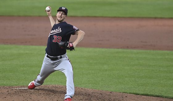 Washington Nationals starting pitcher Erick Fedde (32) throws a pitch during the third inning of a baseball game against the Baltimore Orioles, Tuesday, June 21, 2022, in Baltimore. (AP Photo/Tommy Gilligan)