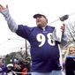 Tony Siragusa, defensive tackle for the Super Bowl-champion Baltimore Ravens, holds the Vince Lombardi trophy as he rides with his wife, Kathy, in a parade in his hometown of Kenilworth, N.J. on March 4, 2001. Siragusa, the charismatic defensive tackle who helped lead a stout Baltimore defense to a Super Bowl title, has died at age 55. Siragusa&#39;s broadcast agent, Jim Ornstein, confirmed the death Wednesday, June 22, 2022. (AP Photo/Jeff Zelevansky, File)
