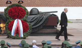 Russian President Vladimir Putin attends a wreath laying ceremony at the Tomb of Unknown Soldier in Moscow, Russia, Wednesday, June 22, 2022, marking the 81st anniversary of the Nazi invasion of the Soviet Union. (Maxim Shipenkov/Pool Photo via AP)
