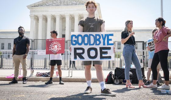 Noah Slayter, 20, of Manassas, Va., poses for a portrait while protesting outside the Supreme Court about abortion, Wednesday, June 15, 2022, in Washington. &amp;quot;Those on the abortion side like to purport that those in foster care could have a terrible life. Who is to say that they&#39;ll have a terrible life? The kids sleeping in the room across from me, there&#39;s people that think they should have been killed,&amp;quot; he said, &amp;quot;previously the movement had one battle, a national one. And now we will have 50.&amp;quot; (AP Photo/Jacquelyn Martin)