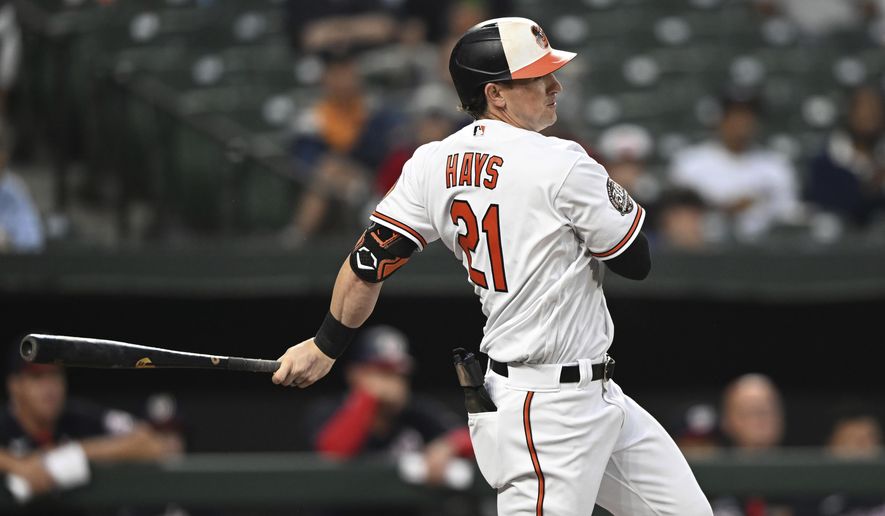 Baltimore Orioles&#x27; Austin Hays follows through on a single against the Washington Nationals during the first inning of a baseball game Wednesday, June 22, 2022, in Baltimore.(AP Photo/Gail Burton)