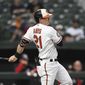 Baltimore Orioles&#39; Austin Hays follows through on a single against the Washington Nationals during the first inning of a baseball game Wednesday, June 22, 2022, in Baltimore.(AP Photo/Gail Burton)