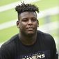 Baltimore Ravens rookie linebacker Jaylon Ferguson walks off the field after an NFL Football rookie camp, Saturday, May 4, 2019, in Owings Mills, Md. Ravens linebacker Jaylon Ferguson has died at age 26, his agent confirmed Wednesday, June 22, 2022. (AP Photo/Gail Burton, File) **FILE**