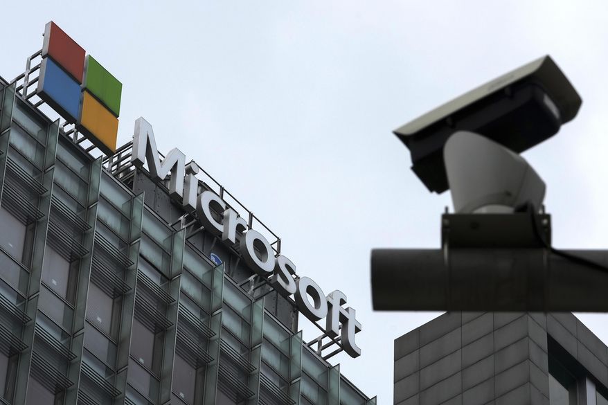 A security surveillance camera is seen near the Microsoft office building in Beijing, July 20, 2021. Coinciding with unrelenting cyberattacks against Ukraine, state-backed Russian hackers have engaged in “strategic espionage” against governments, think tanks, businesses and aid groups in 42 countries supporting Kyiv, Microsoft says in a new report. (AP Photo/Andy Wong, File)