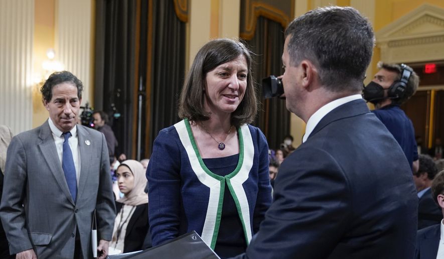 Committee member Rep. Elaine Luria, D-Va., greets Steven Engel, former assistant attorney general for the Office of Legal Counsel, at the end of House select committee investigating the Jan. 6, 2021, attack on the U.S. Capitol hearing at the Capitol in Washington, Thursday, June 23, 2022. At left is Rep. Jamie Raskin, D-Md. (AP Photo/Jacquelyn Martin)