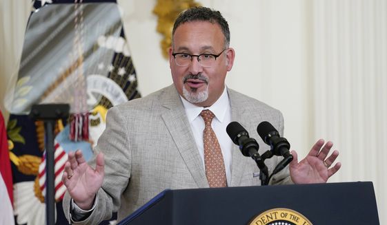 In this file photo, Education Secretary Miguel Cardona speaks in the East Room of the White House in Washington, April 27, 2022. The Biden administration proposed a dramatic rewrite of campus sexual assault rules on Thursday, June 23, moving to expand protections for LGBTQ students, bolster the rights of victims and widen colleges&#39; responsibilities in addressing sexual misconduct. The proposal was announced on the 50th anniversary of the Title IX women’s rights law. Cardona said Title IX has been “instrumental” in fighting sexual assault and violence in education. (AP Photo/Susan Walsh, File)