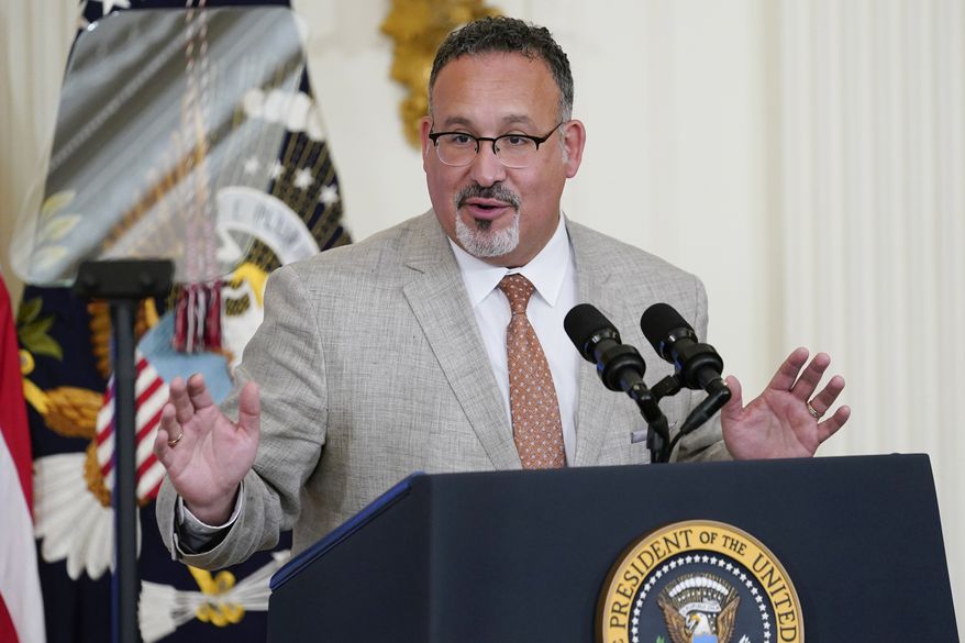 In this file photo, Education Secretary Miguel Cardona speaks in the East Room of the White House in Washington, April 27, 2022. The Biden administration proposed a dramatic rewrite of campus sexual assault rules on Thursday, June 23, moving to expand protections for LGBTQ students, bolster the rights of victims and widen colleges&#39; responsibilities in addressing sexual misconduct. The proposal was announced on the 50th anniversary of the Title IX women’s rights law. Cardona said Title IX has been “instrumental” in fighting sexual assault and violence in education. (AP Photo/Susan Walsh, File)