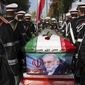 FILE - In this photo released by the official website of the Iranian Defense Ministry, military personnel stand near the flag-draped coffin of Mohsen Fakhrizadeh, a scientist who was killed on Friday, during a funeral ceremony in Tehran, Iran, Monday, Nov. 30, 2020. A court in Iran on Thursday, June 23, 2022 ordered the United States government to pay over $4 billion to the families of Iranian nuclear scientists who have been killed in targeted attacks in recent years, state-run media reported. (Iranian Defense Ministry via AP, File)