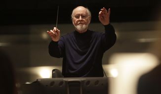 This 2017 photo released by Lucasfilm Ltd. shows John Williams, a five-time Oscar-winning composer. Williams, 90, is devoting himself to composing concert music, including a piano concerto he’s writing for Emanuel X. This spring, he and cellist Yo-Yo Ma released the album “A Gathering of Friends,” recorded with the New York Philharmonic. (Jamie Trueblood/Lucasfilm Ltd. via AP)