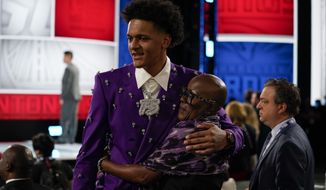 Paolo Banchero talks with friends and family before the start of the NBA basketball draft, Thursday, June 23, 2022, in New York. (AP Photo/John Minchillo)