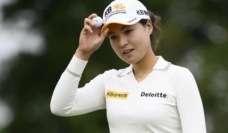 In Gee Chun, of South Korea, holds her ball after finishing her round on the ninth hole during the first round in the Women&#39;s PGA Championship golf tournament at Congressional Country Club, Thursday, June 23, 2022, in Bethesda, Md. (AP Photo/Nick Wass)