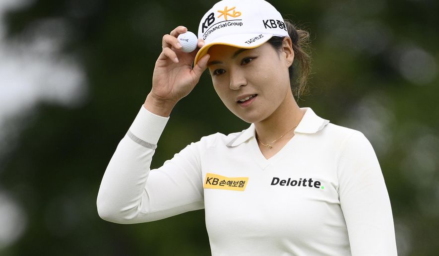 In Gee Chun, of South Korea, holds her ball after finishing her round on the ninth hole during the first round in the Women&#39;s PGA Championship golf tournament at Congressional Country Club, Thursday, June 23, 2022, in Bethesda, Md. (AP Photo/Nick Wass)