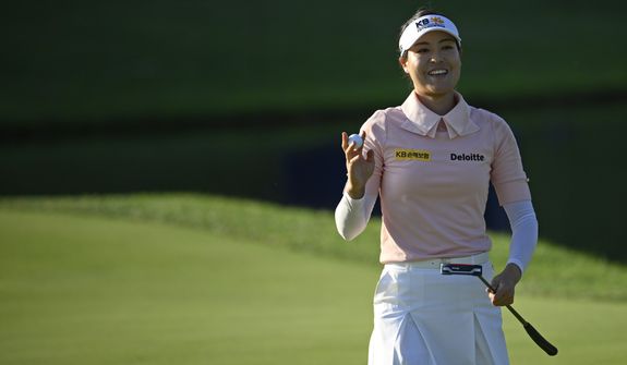 In Gee Chun, of South Korea, holds her ball after putting on the 18th hole during the second round in the Women&#39;s PGA Championship golf tournament at Congressional Country Club, Friday, June 24, 2022, in Bethesda, Md. (AP Photo/Nick Wass)