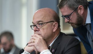 Chairman Jim McGovern, D-Mass., confers with an aide as the House Rules Committee prepared the bipartisan Senate gun bill for the House floor in response to the recent mass shootings in Texas and New York, at the Capitol in Washington, Friday, June 24, 2022. (AP Photo/J. Scott Applewhite) ** FILE **